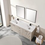 A modern bathroom features the Torino 72 Inch Double Sink Bathroom Vanity Cabinet with two rectangular mirrors, black faucets, white sinks, a marble countertop, towels on both sides, a basket of rolled towels, and gray tile flooring.