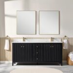 A modern bathroom features the Torino 72 Inch Double Sink Bathroom Vanity Cabinet with brass fixtures, two gold-framed rectangular mirrors, towel rings with white towels on each side, and a basket of rolled towels on the right.