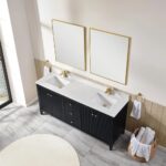 A modern bathroom featuring the Torino 72 Inch Double Sink Bathroom Vanity Cabinet with black finish, white marble countertop, gold faucets, two frameless mirrors, towels on gold rings, and a round laundry basket on marble tile floor.